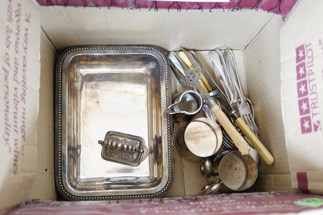 A quantity of assorted plated items including entrée dishes, flatware and mugs.